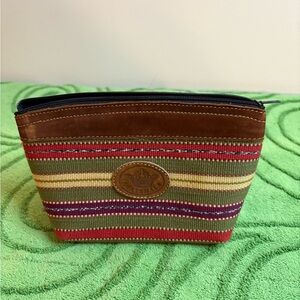 Guatemalan striped cosmetic pouch handmade with leather trim. Handwoven fabric
